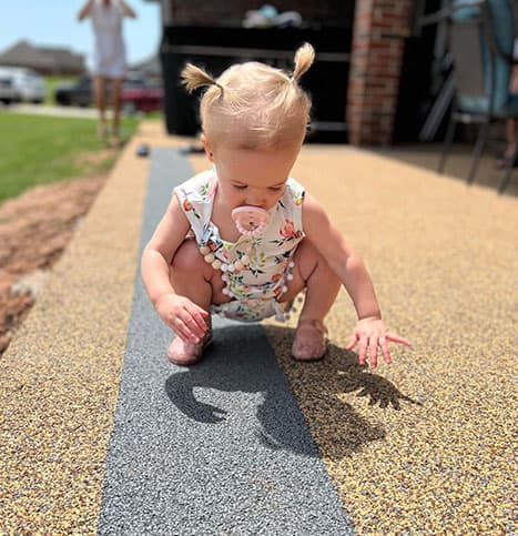 Child safely playing on Softroc patio surface